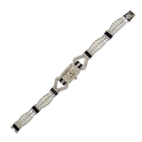 Art Deco diamond, pearl and onyx wristwatch by Cartier, Paris, with a silvered rectangular dial,